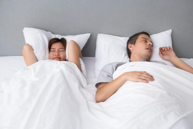 Woman annoyed by husband's snoring