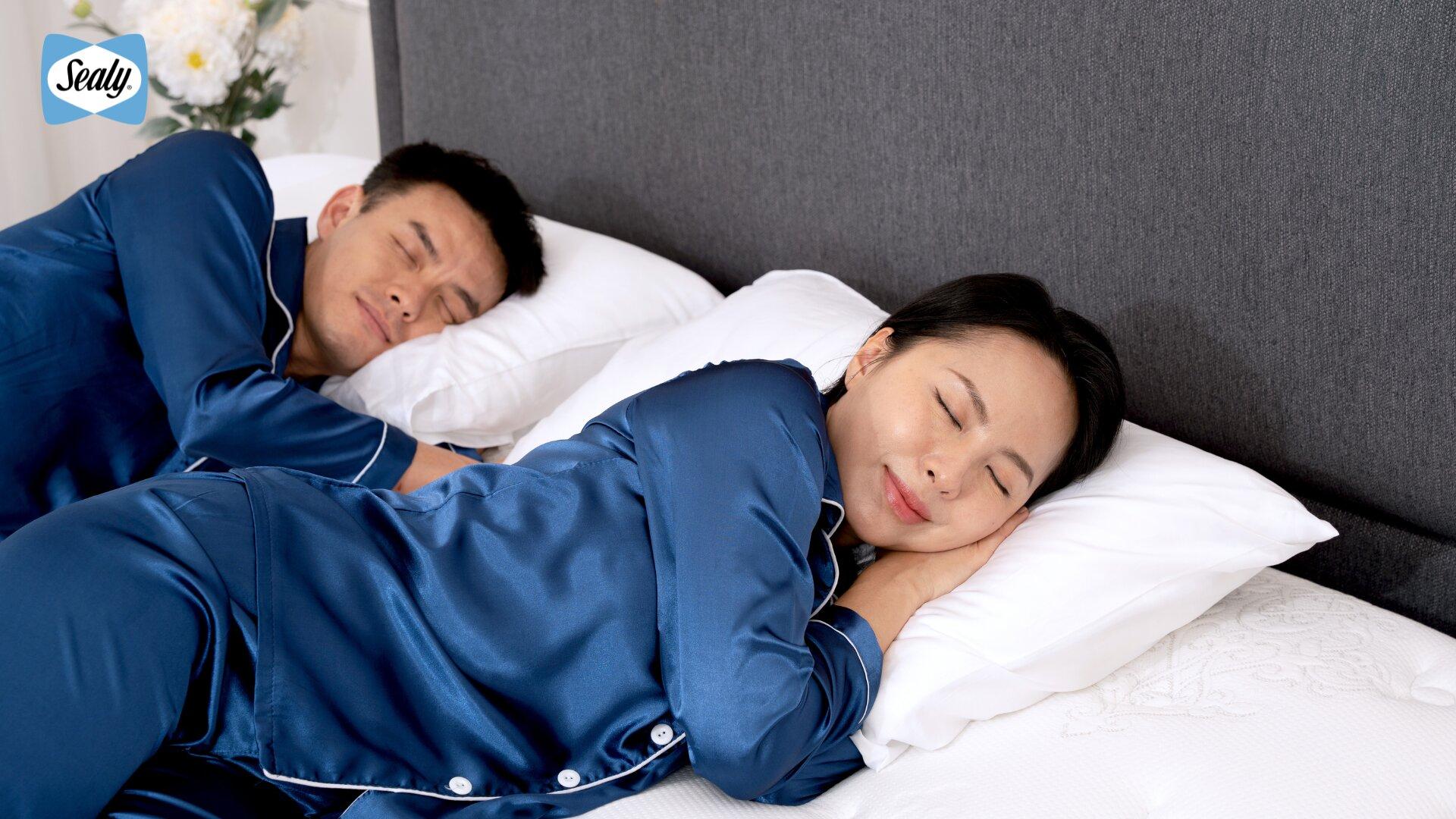 The Science Behind Sealy's Adjustable Beds: Engineered to Move, Designed to Support 1 Couple sleeping soundly and undisturbed side by side on a Sealy mattress